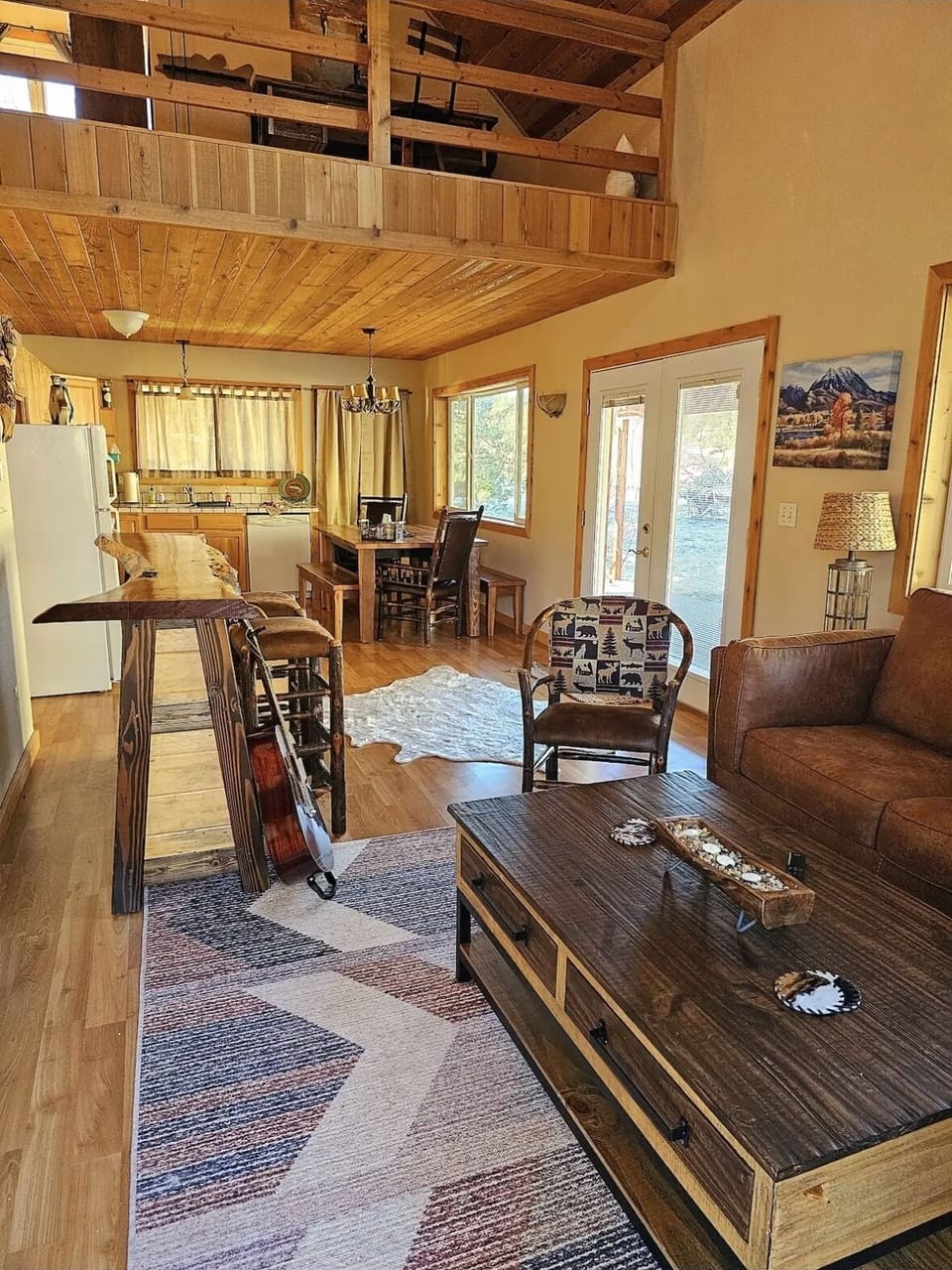 View of the living/bar/kitchen areas with fly tying nook above.