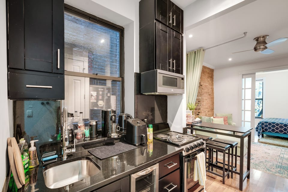 Kitchen with refrigerator,microwave, stove, dishwasher, coffee machine, airfrier
