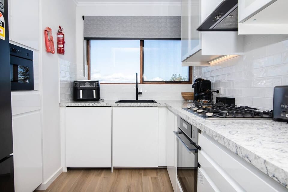 The stylish kitchen comes fully equipped for your holiday catering and includes a Nespresso coffee machine.