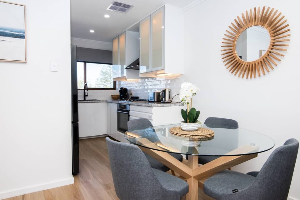  Come together for a meal at home at the four-person dining table making use of the gourmet kitchen.
