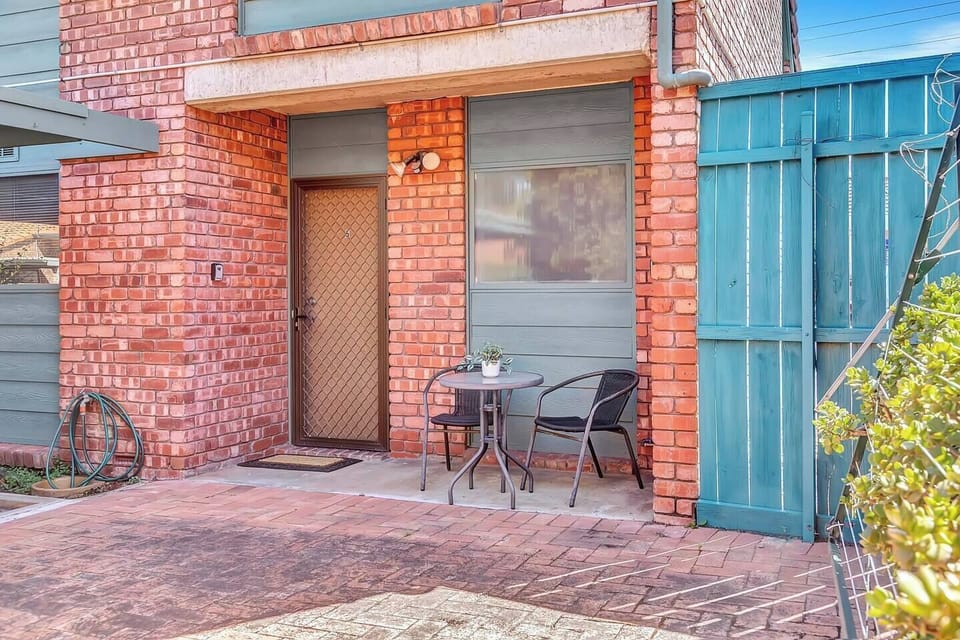 Step outside with your morning coffee in the private courtyard with a quaint outdoor setting.