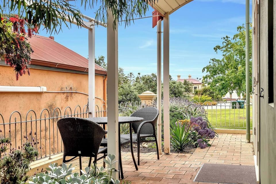 Off the main living area, you'll find a picturesque patio offering the perfect spot to enjoy your morning cuppa.