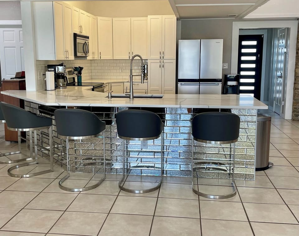 Full Stocked Kitchen with Bar Sitting