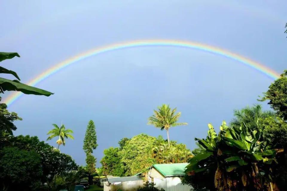 Enjoy views of a lush organic produce and coffee farm from your private lanai