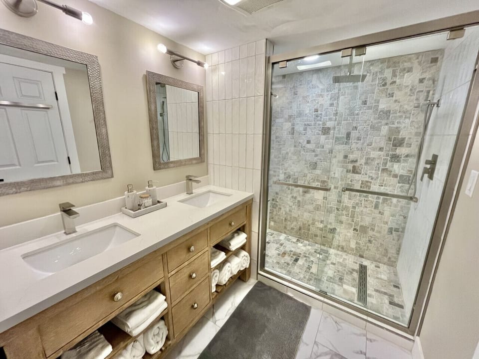 Lux master bath with walk-in shower, rain showerhead & his & her sinks