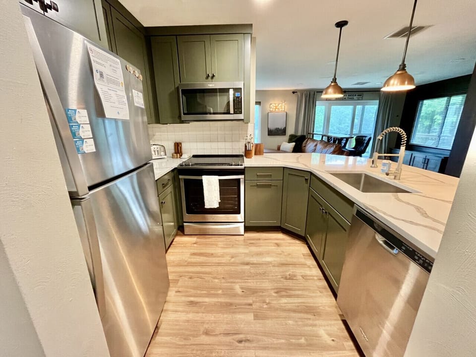 Modern kitchen with granite countertops & stainless appliances