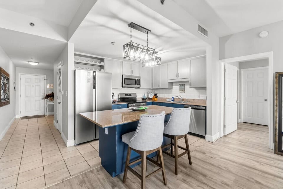 Fully stocked kitchen with island that has seating for 2
