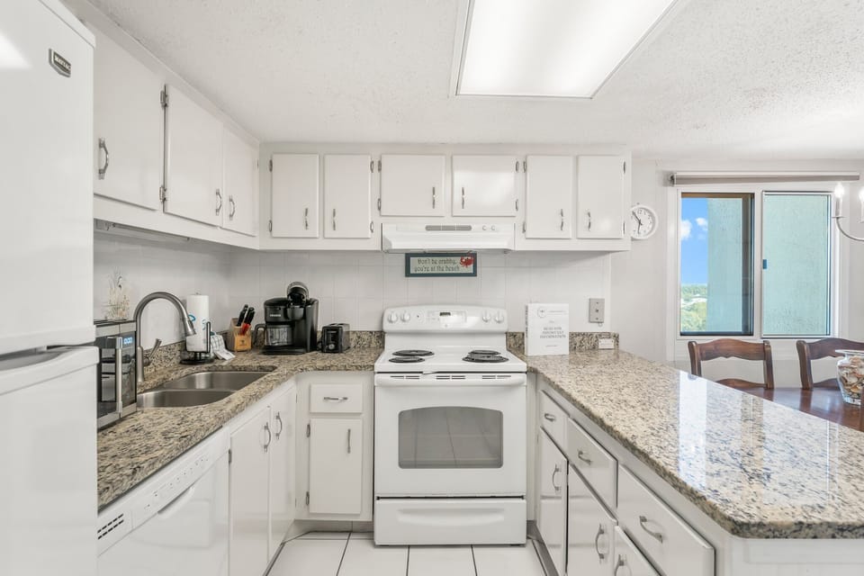 The kitchen affords plenty of storage and workspace.