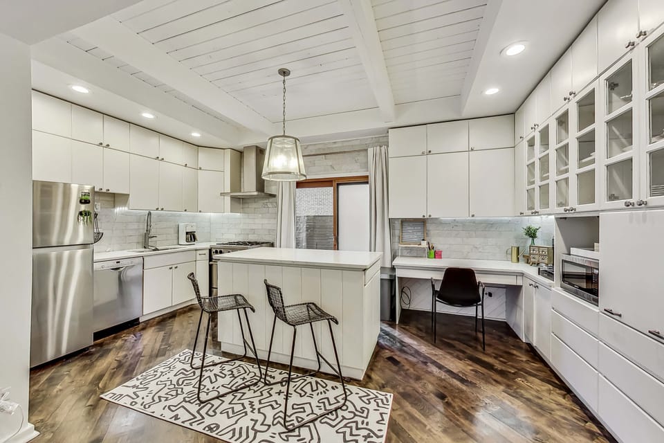 The large kitchen has ample storage and newer appliances.