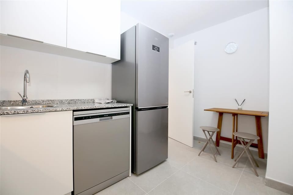 Another view of the modern kitchen with breakfast table for two guests
