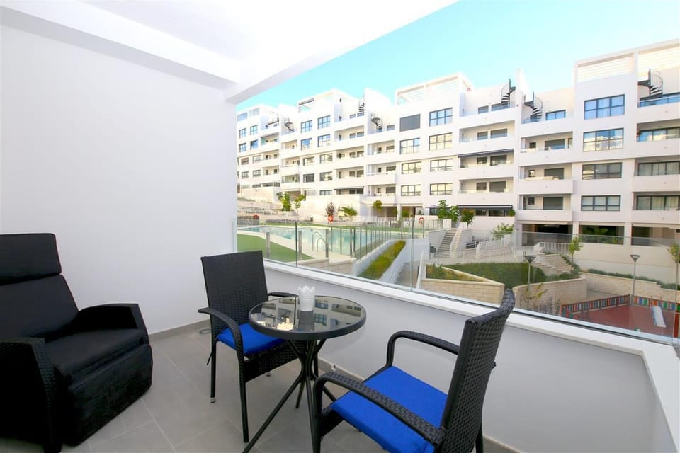Terrace with outdoor dining area for two guests and relaxing seater