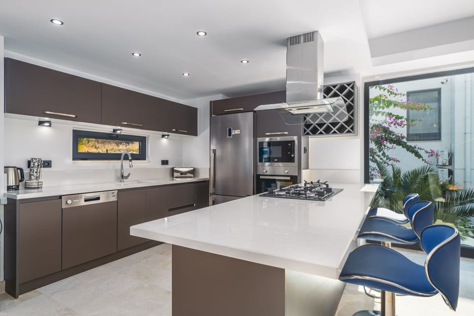 Modern fully fitted kitchen with an island unit