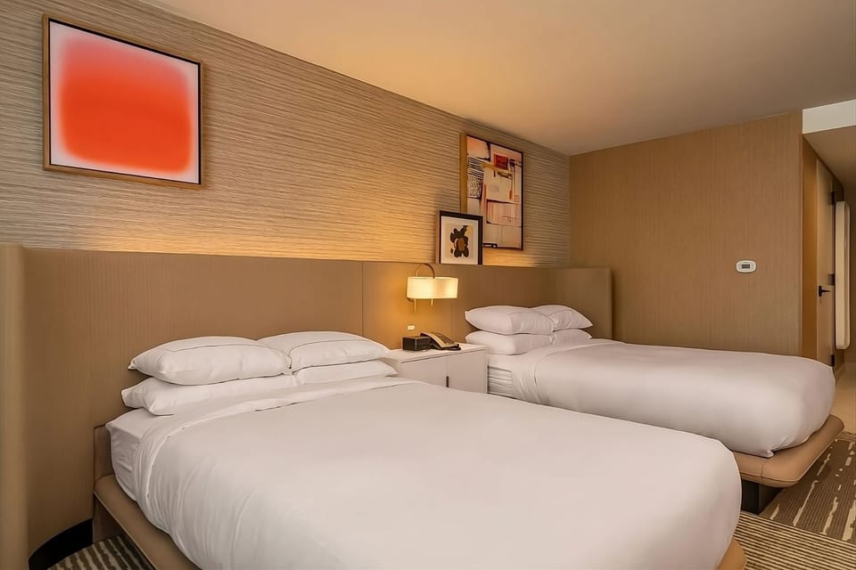 Recharge after adventures in a clean, modern double-bed layout.