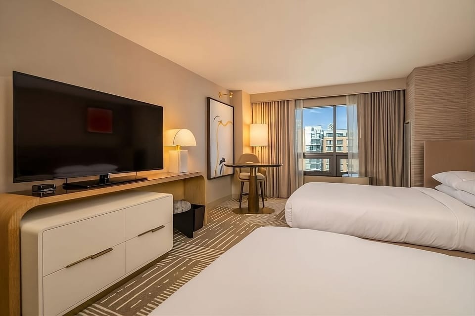Unwind with movie nights and bright city-facing windows.