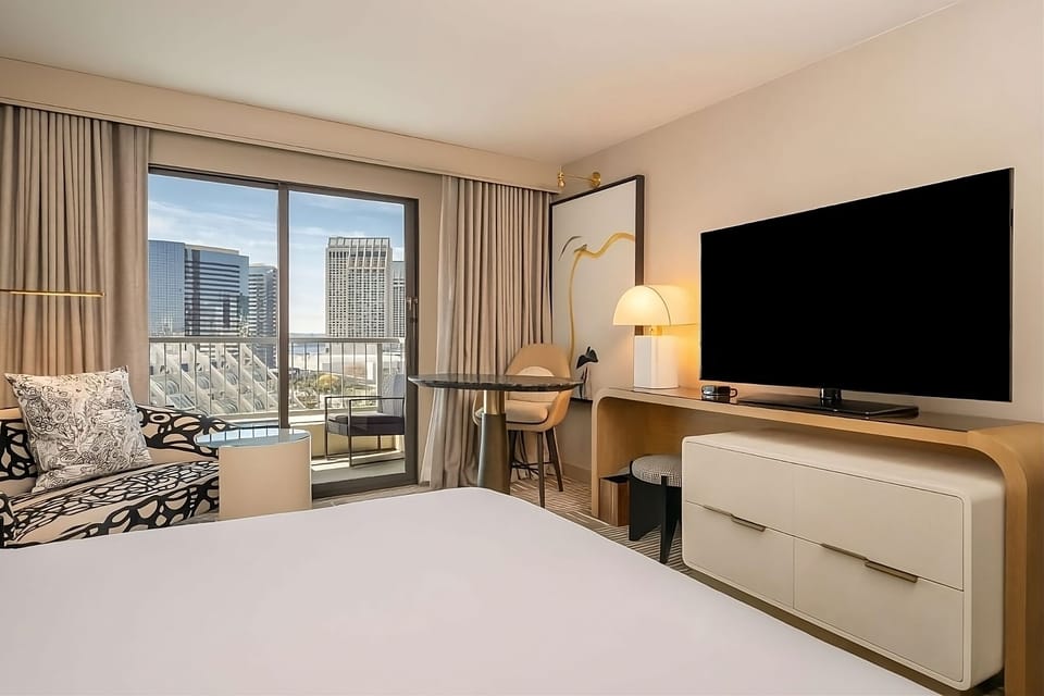 Unwind with skyline views and a movie night in bed.