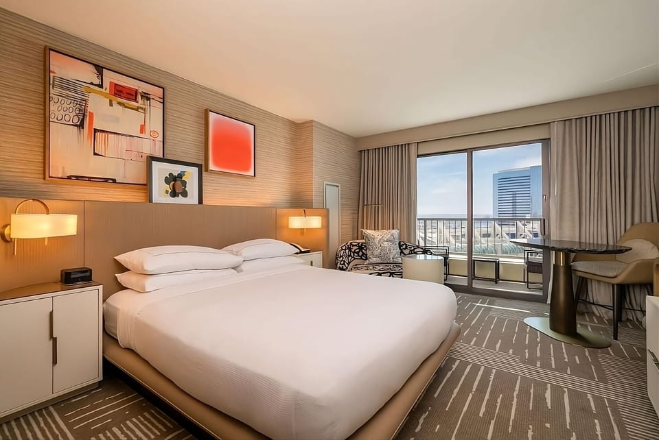 Sink into crisp linens and wake to city panoramas.