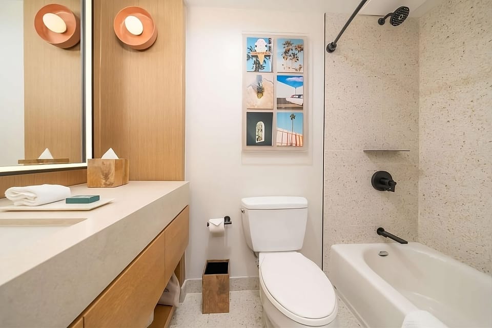 Soak and reset with a deep tub and bright vanity.