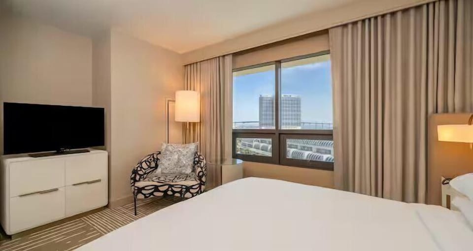 Settle in comfortably with a lounge chair and calm city outlook.