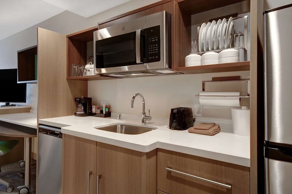 Start mornings with fresh coffee and an easy in-room kitchenette.