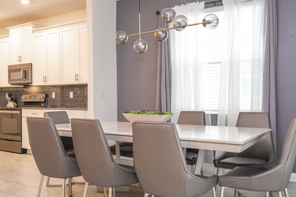 Separate dining area with chairs.