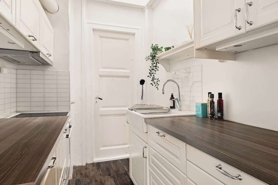 Fully equipped with essentials and plenty of counter space in a charming white finish.