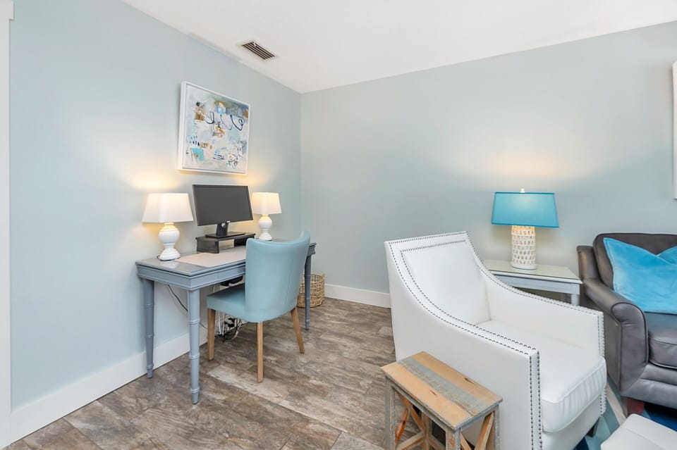 Workspace Nook – Work, Write, or Plan Your Island Day - Need to check in with the office or map out your St. Simons adventures? This tucked-away desk makes it easy to stay productive—just enough separation without missing a moment.