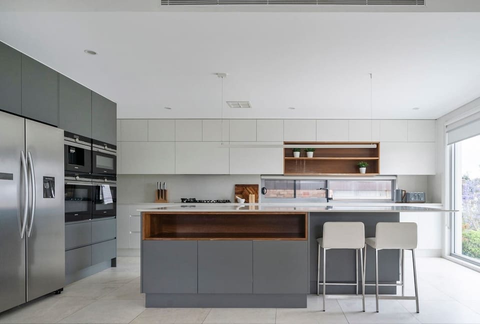 A gourmet kitchen is designed around an island with a breakfast bar for slow mornings at home.