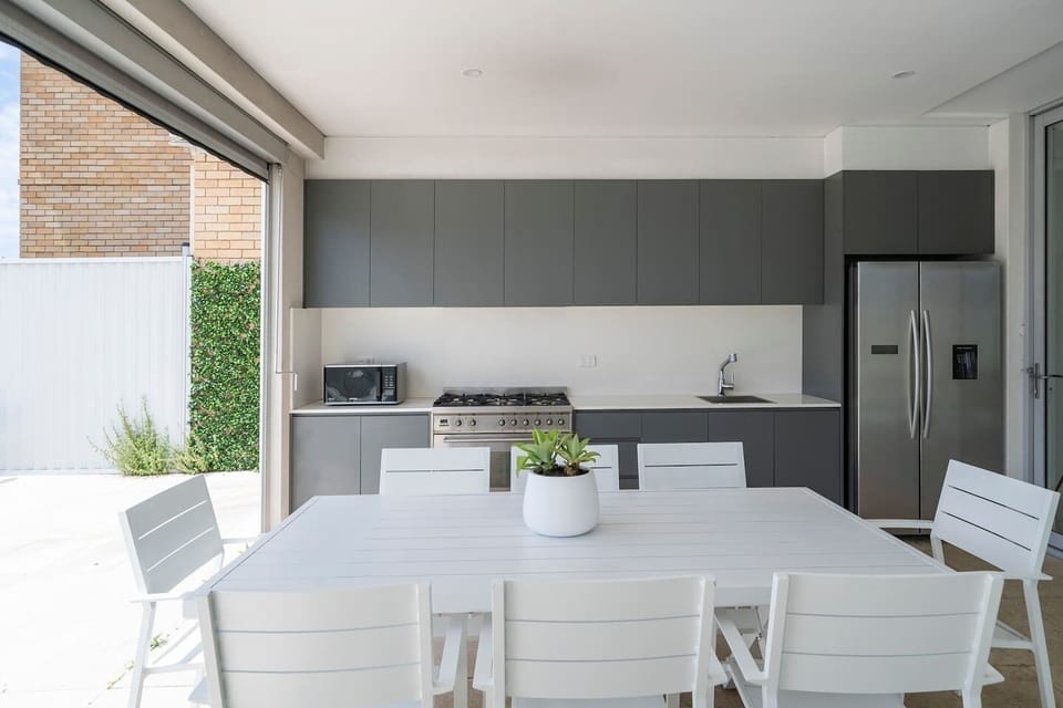 An outdoor kitchen and BBQ make it easy to whip up a feast and dine outside.