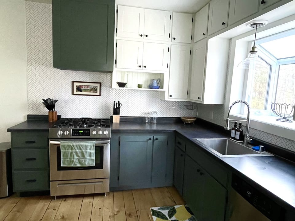 Kitchen with gas range, dishwasher, garbage disposal, and microwave