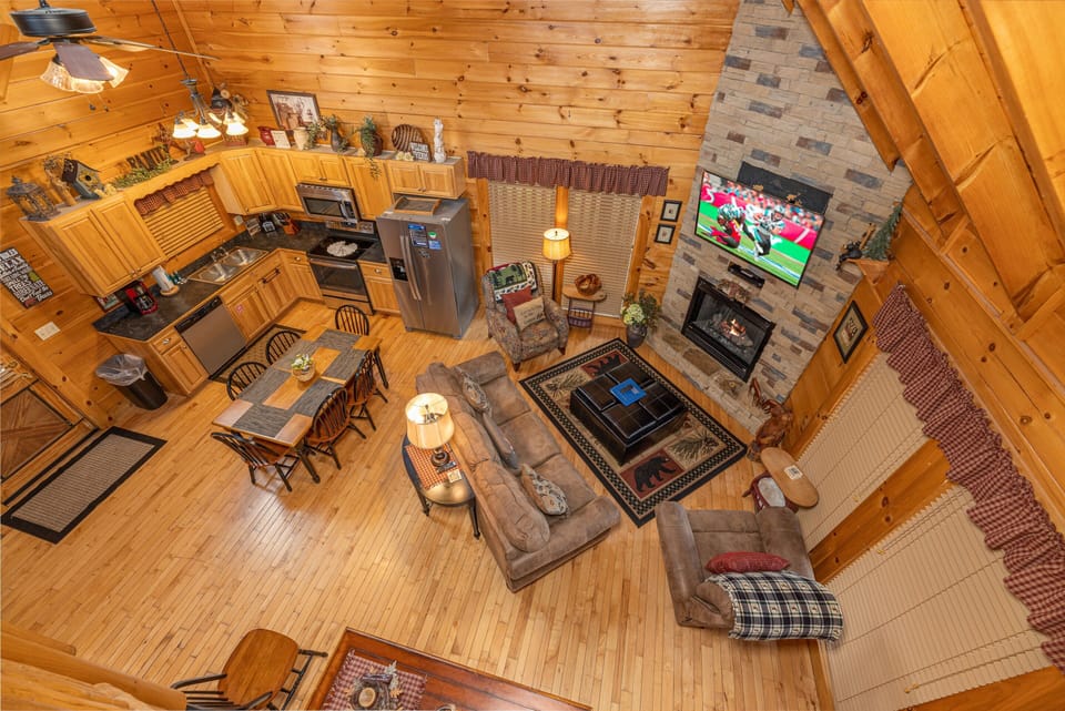 Looking down at the living room at Absolutely Wonderful, a 2 bedroom cabin rental located in Pigeon Forge