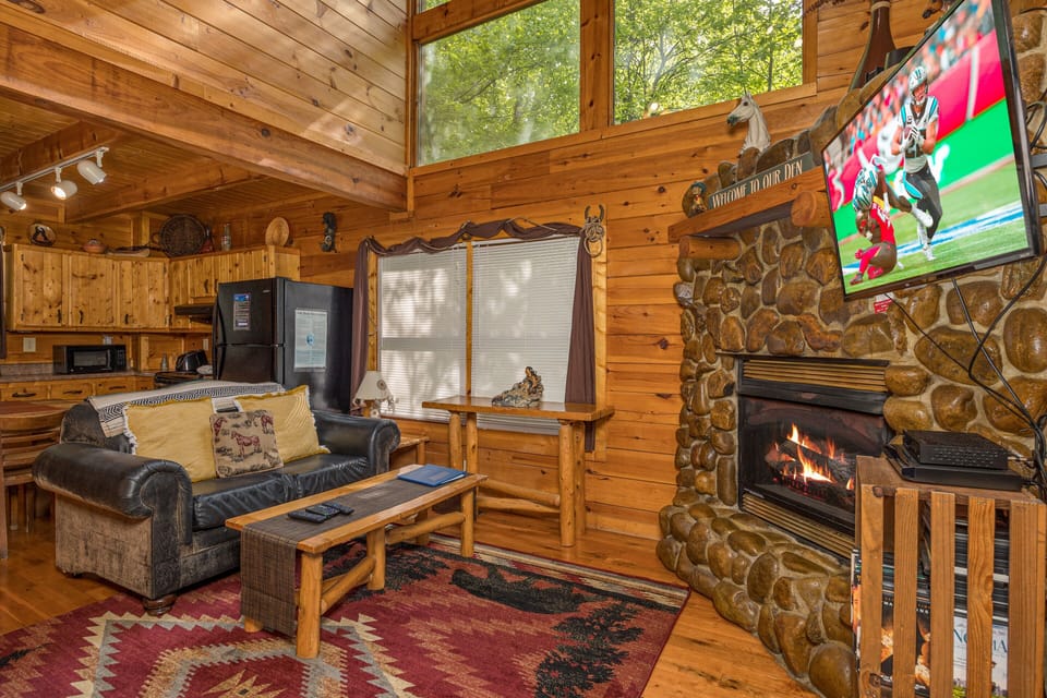 Living room with stone fireplace