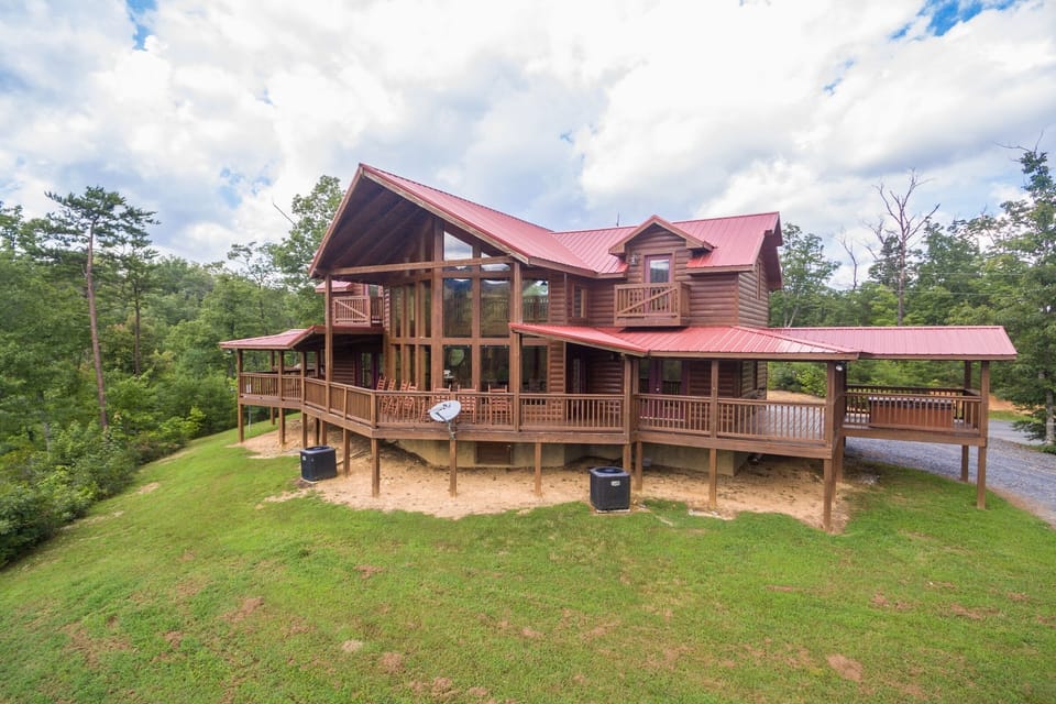 Exterior looking back at the cabin from the yard in front at Four Seasons Lodge, a 3-bedroom cabin rental located in Pigeon Forge