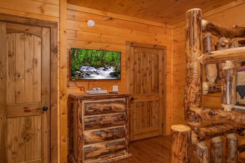Bunk room with a Dresser and TV