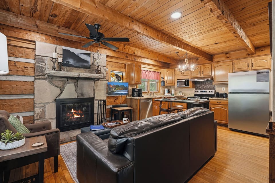Relax by the stone fireplace or cook in your fully equipped kitchen while exposed beams and warm wood create your cozy mountain retreat.