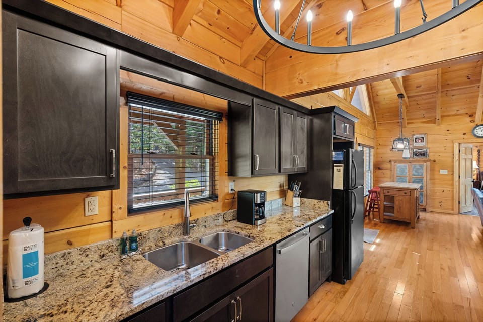 Full kitchen with dark wood cabinets