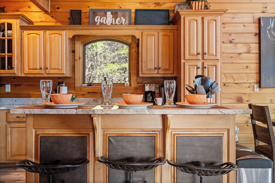 Kitchen with breakfast bar and stainless appliances at Mountain Mama, a 3 bedroom cabin rental located in Pigeon Forge
