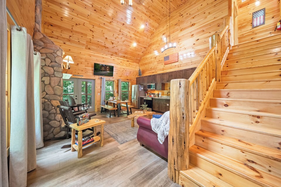 OPEN CONCEPT with a fireplace, sofa bed, dining, natural lighting & views