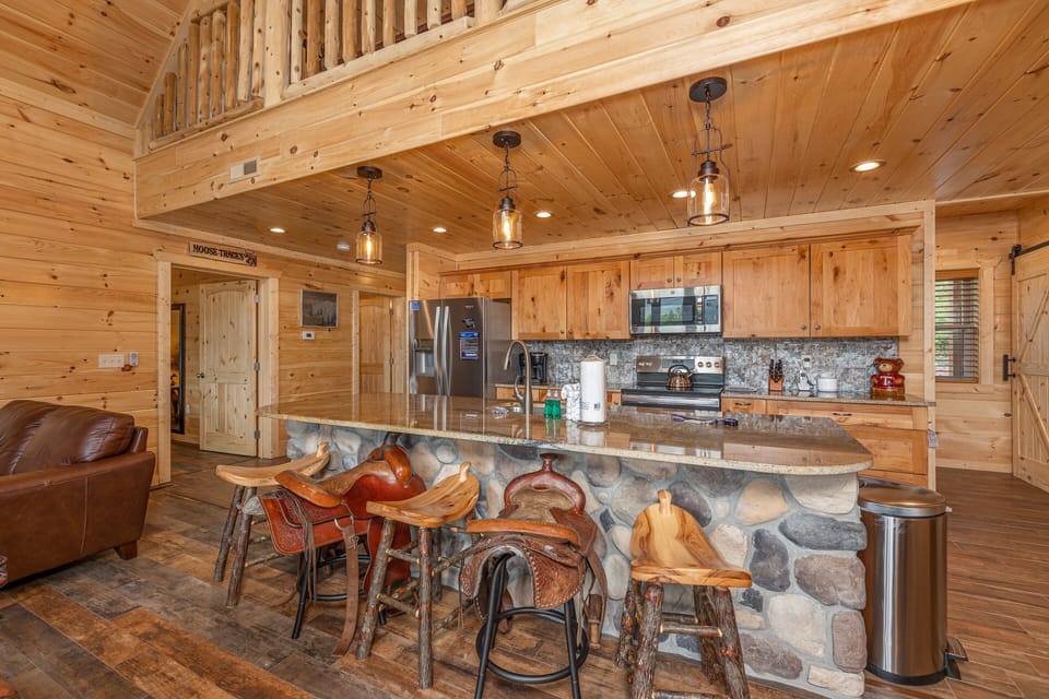 Full kitchen with island and horse sattle stools