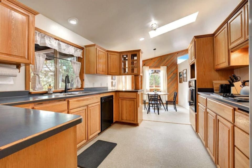 Large fully stocked kitchen with JennAir stove and coffee station.