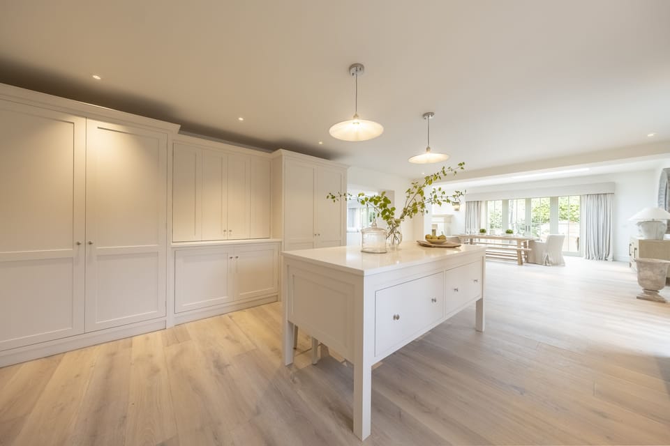 Ground floor: Kitchen island and ample storage in the kitchen