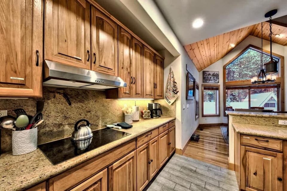 Well-appointed South Lake Tahoe kitchen with electric range, built-in oven, dishwasher, refrigerator and generous counter space, making it easy to prepare meals for the whole group.