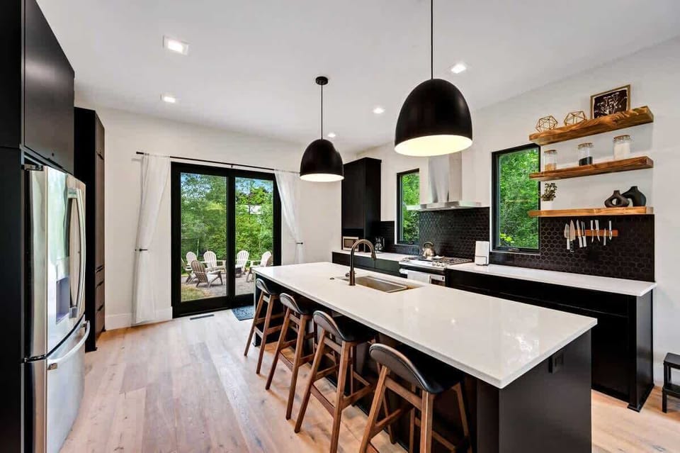 The chef's kitchen is a culinary haven, equipped with state-of-the-art appliances and an abundance of counter space for your gourmet creations.