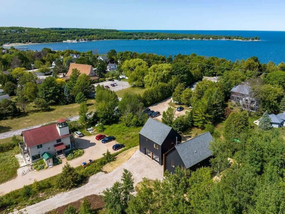 Welcome to the Nordica House, a modern and design-driven retreat in the heart of Egg Harbor. With 4 bedrooms and 3 bathrooms, this spacious property offers a perfect blend of style and comfort.