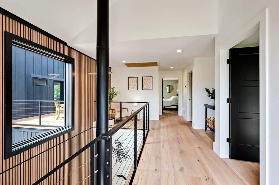 Upstairs hallway in the Main House leading to three bedrooms, laundry room and upper breezeway. 
