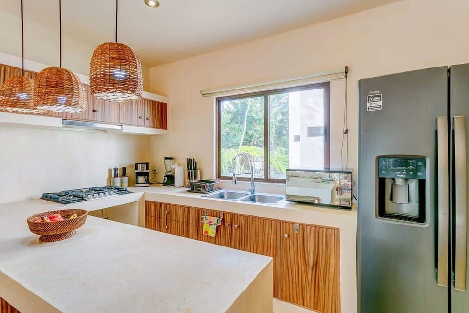 A fully equipped kitchen with a sleek design and high-end appliances