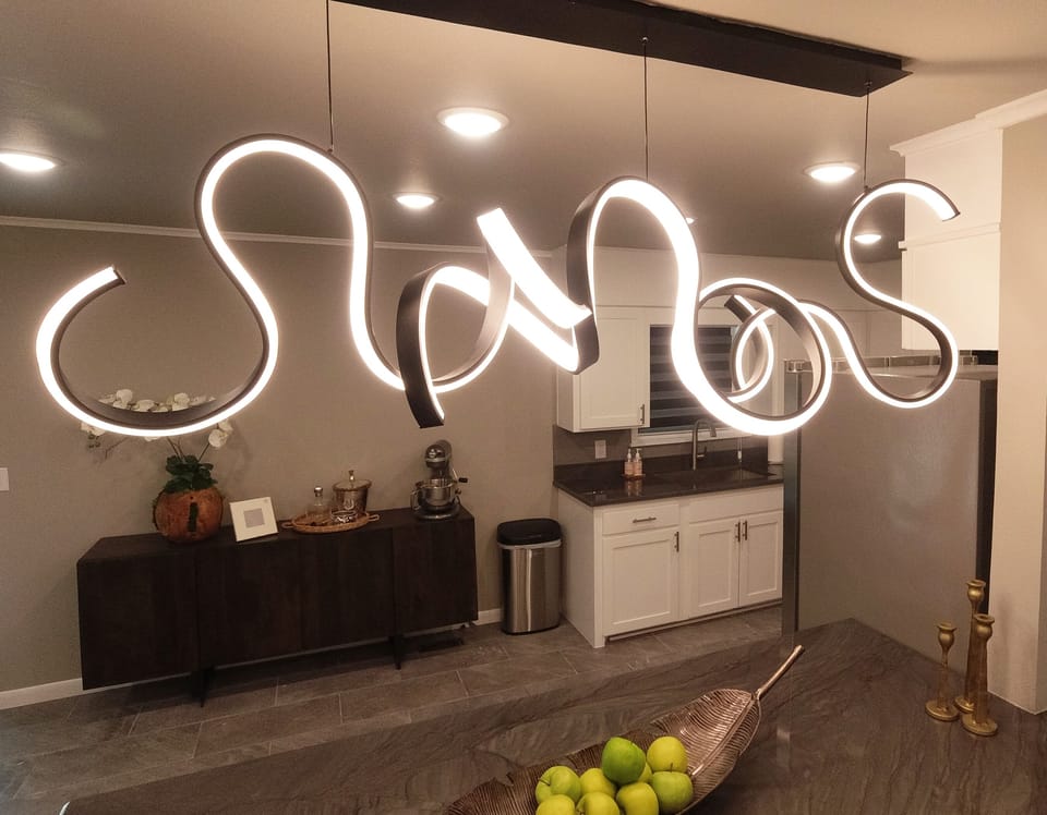 Enjoy a quick snack at the bar while being able to visit with those in the kitchen or living room.  Kitchen & Bar Area