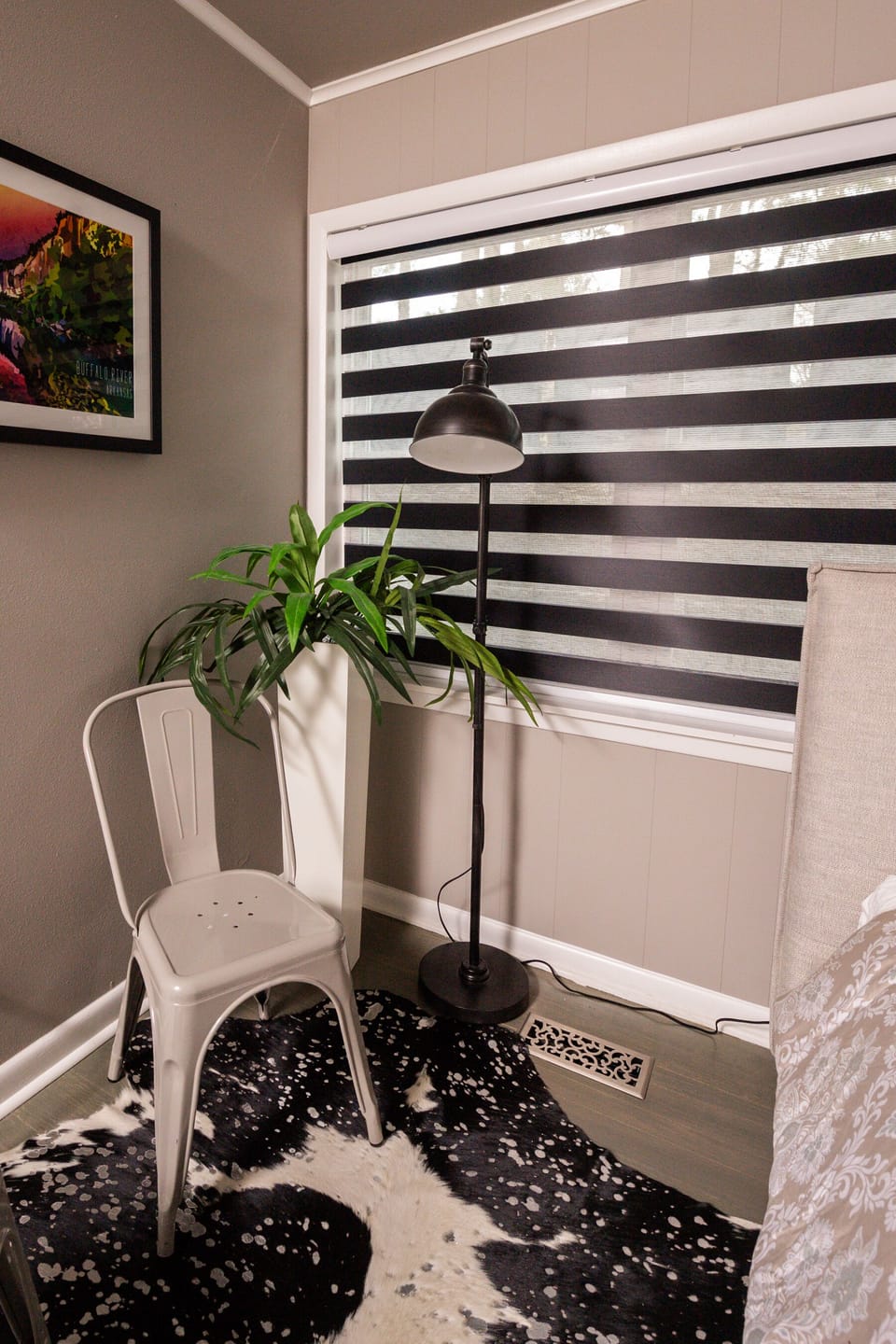 Bedroom with queen bed, and lighting you can position to illuminate a specific area without causing any disturbance other others.  Downstairs Bedroom