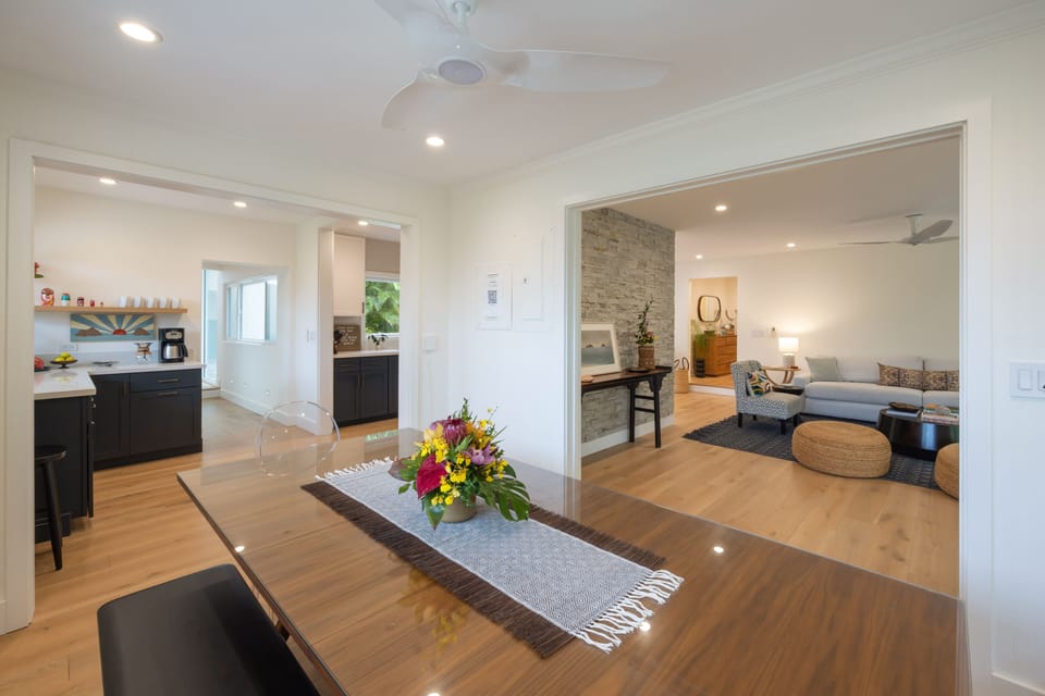 Dine in style and soak in the scenery from your indoor table—steps from both the kitchen and garden-facing lanai.