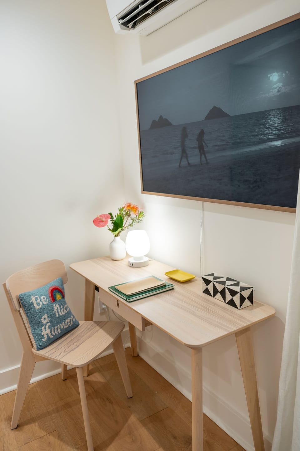 A cozy nook for reading, journaling, or sipping tea—featuring ocean photography and a personal island moment of calm.