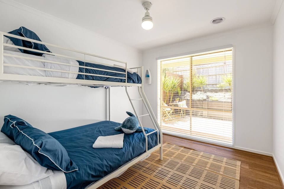 The third bedroom sleeps three—featuring a combination bunk bed with a single up top and double on the bottom.